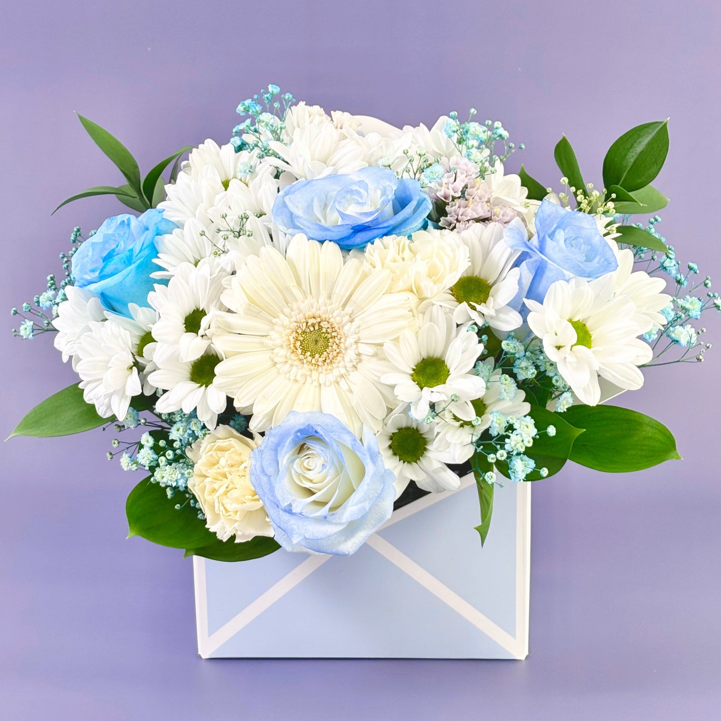 Blue flower in box of envelop flower delivery Sydney