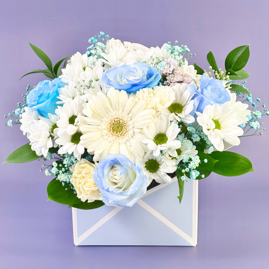 Blue flower in box of envelop flower delivery Sydney