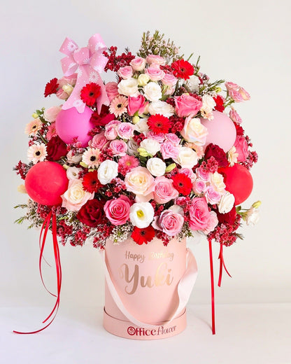 Sydney birthday flower box in a pink gift box with fresh blooms and red and pink balloons for a festive look