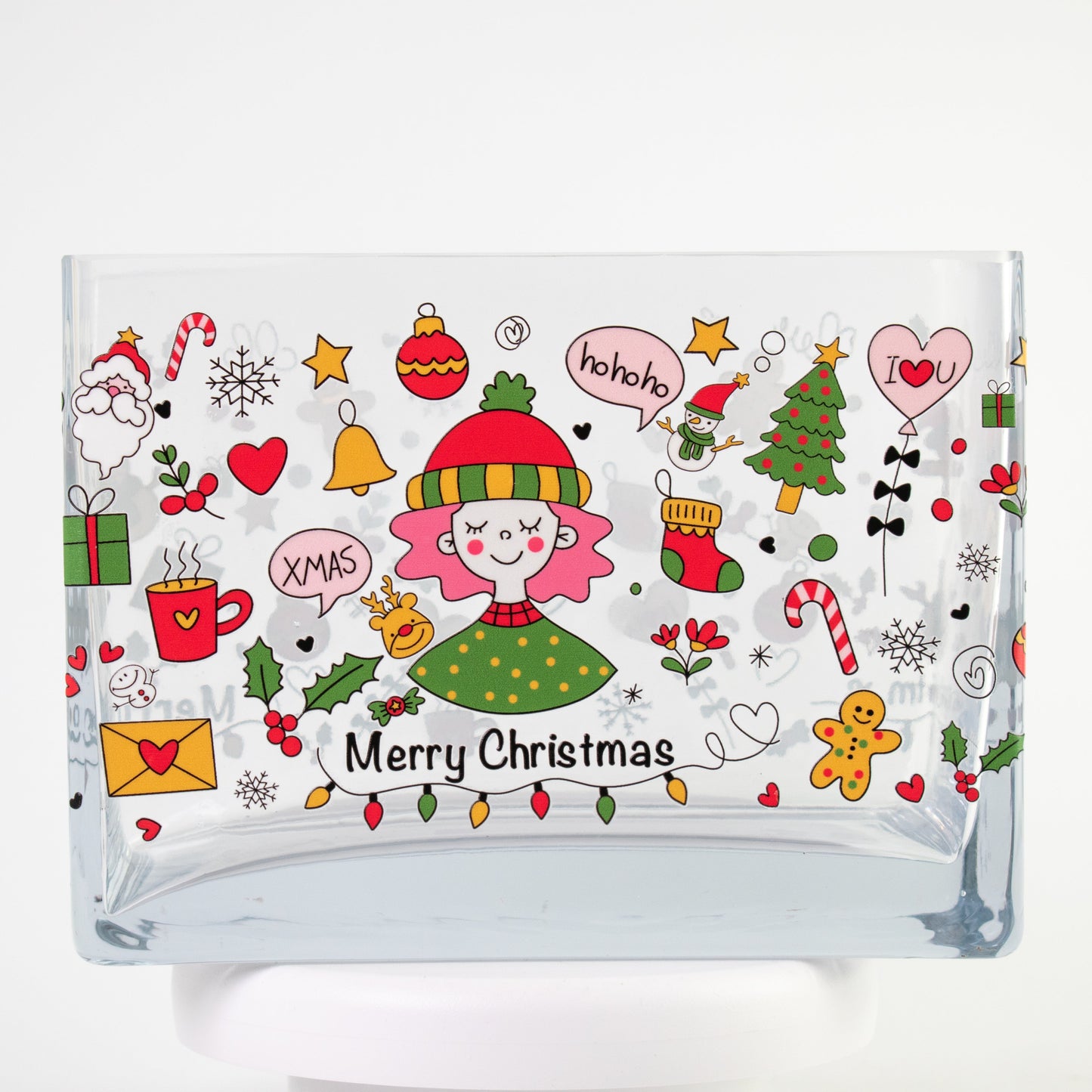 Clear glass vase with a colourful Christmas design featuring Santa, candy canes, gifts, stars, and “Merry Christmas” text — size 20x10x15 cmH.