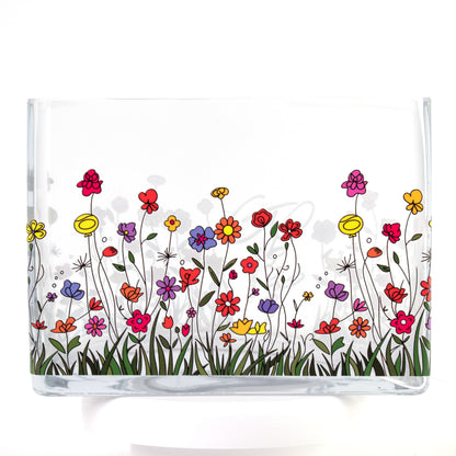 Clear glass vase with a colourful wildflower design featuring red, purple, yellow, and orange flowers — size 20x10x15 cmH.