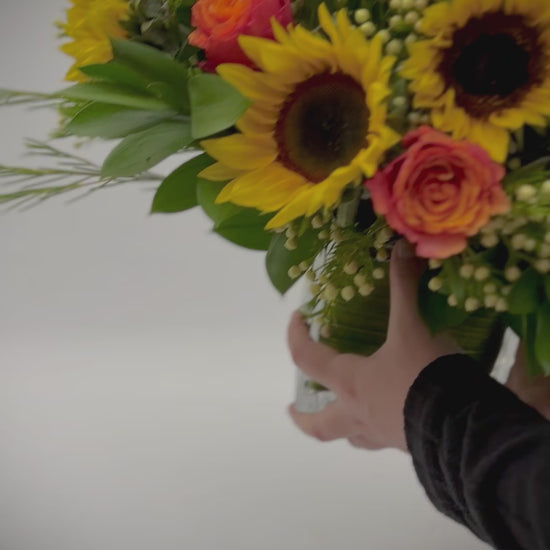 Sunflower and orange roses