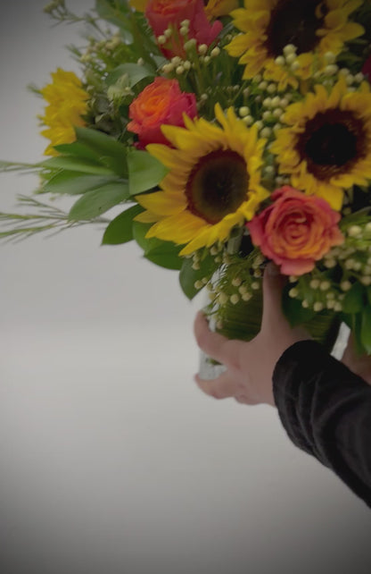 Sunflower and orange roses