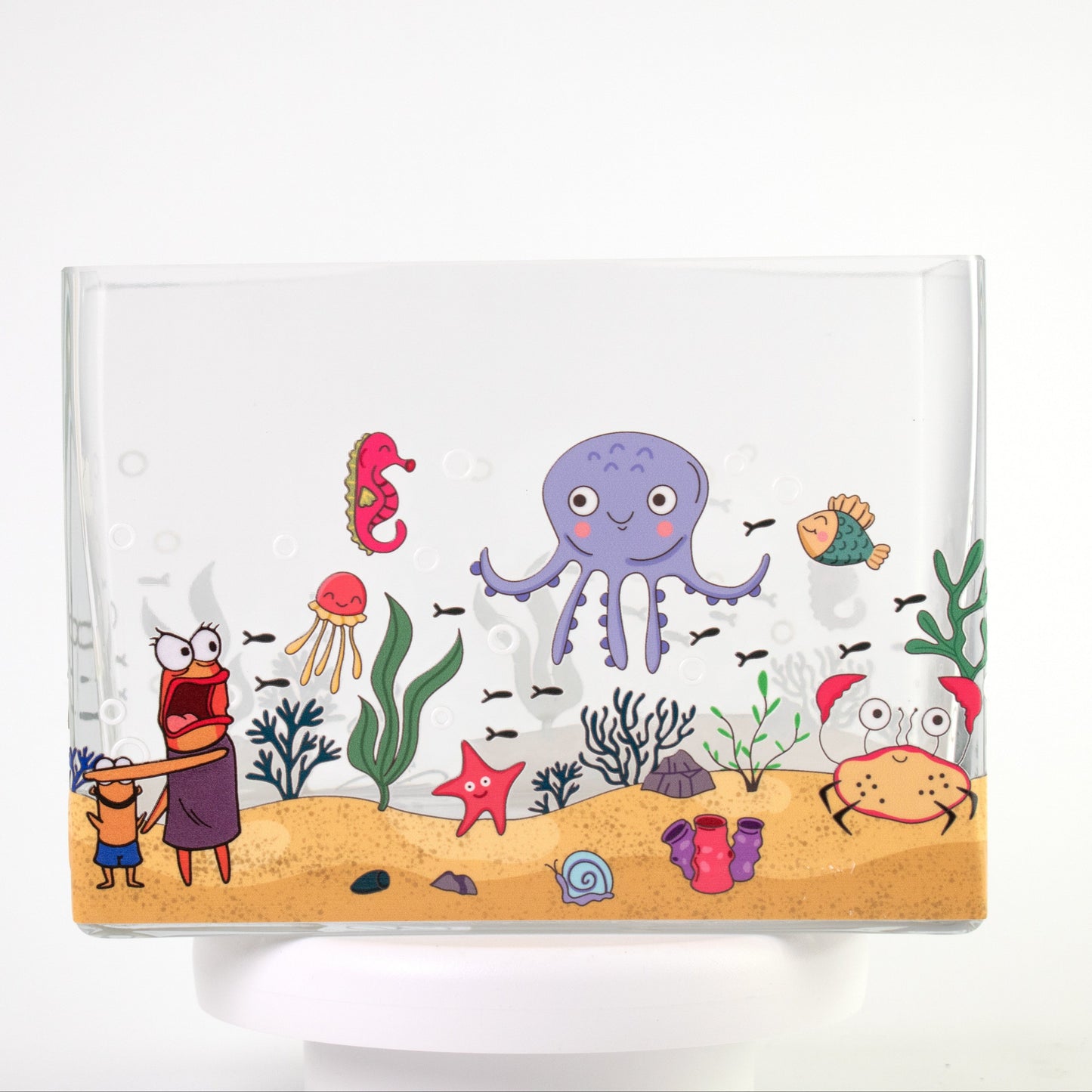 Clear glass vase with a colourful underwater scene featuring octopus, crab, jellyfish, fish, and coral — size 20x10x15 cmH.